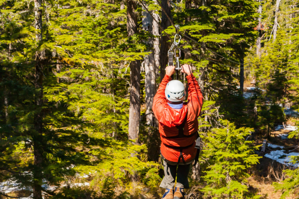 Man travelling through canopy tour