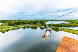 man ziplining in Florida