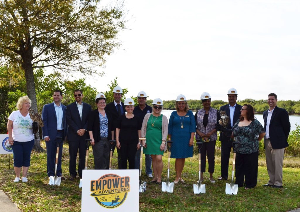 The mayor of Oldsmar, council members, and other area representatives pose with shovels to mark the official groundbreaking of Empower Adventures Tampa Bay.